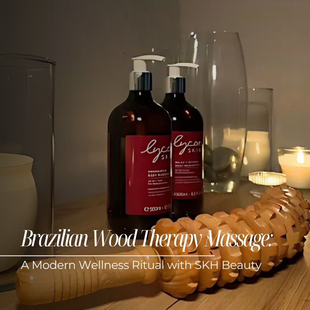 Wood massage therapy tool next to LYCON Masssage Oils on a table with candles before a treatment.